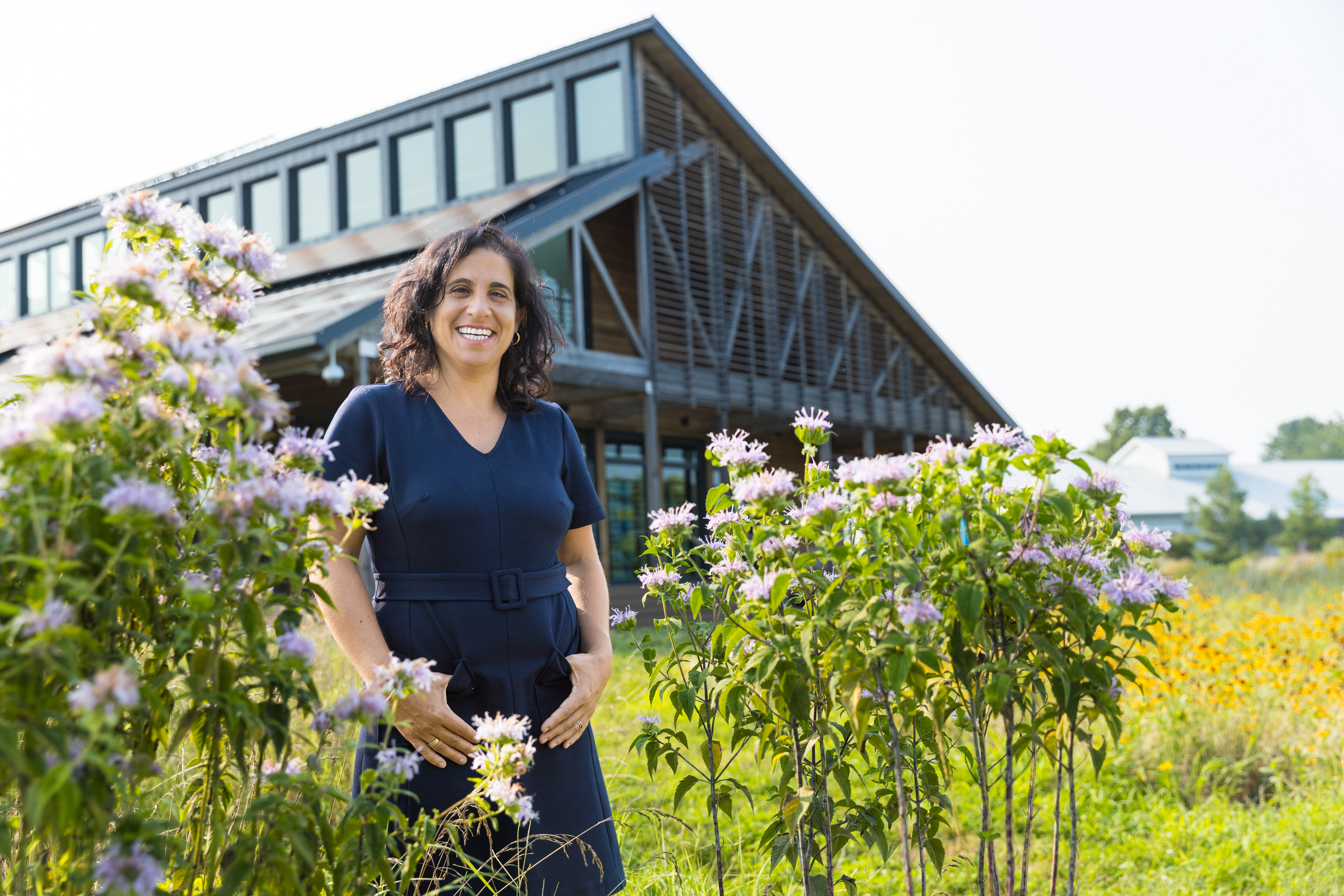 Valerie Imbruce standing outside of Semans Griswold Environmental Hall