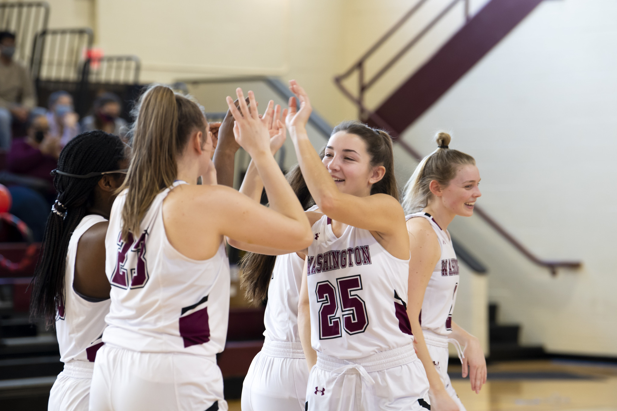 WC women's volleyball team members celebrate