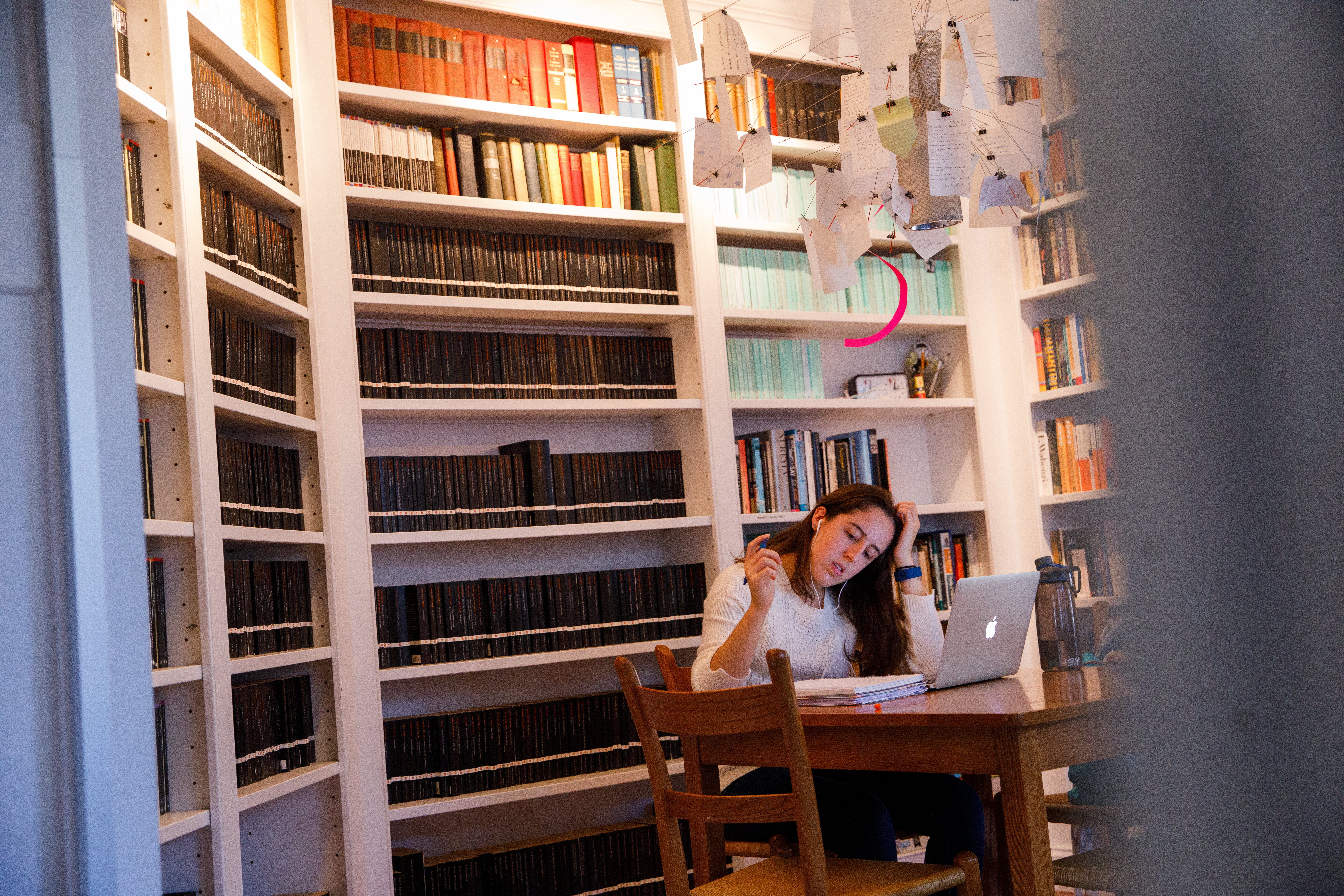 student studying in library