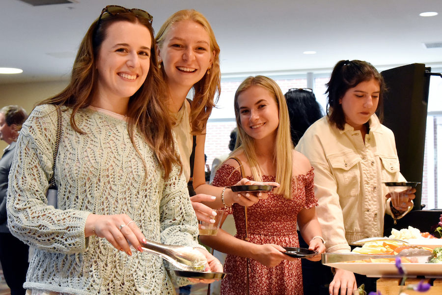 students in a buffet line