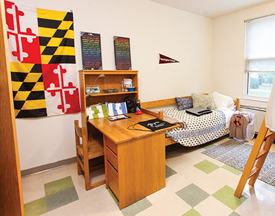 dorm room with Maryland flag, College pennant