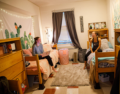 two students in a Queen Anne's house room