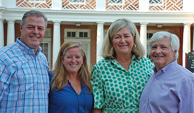 Four Washington College parents in front of Casey Academic Center