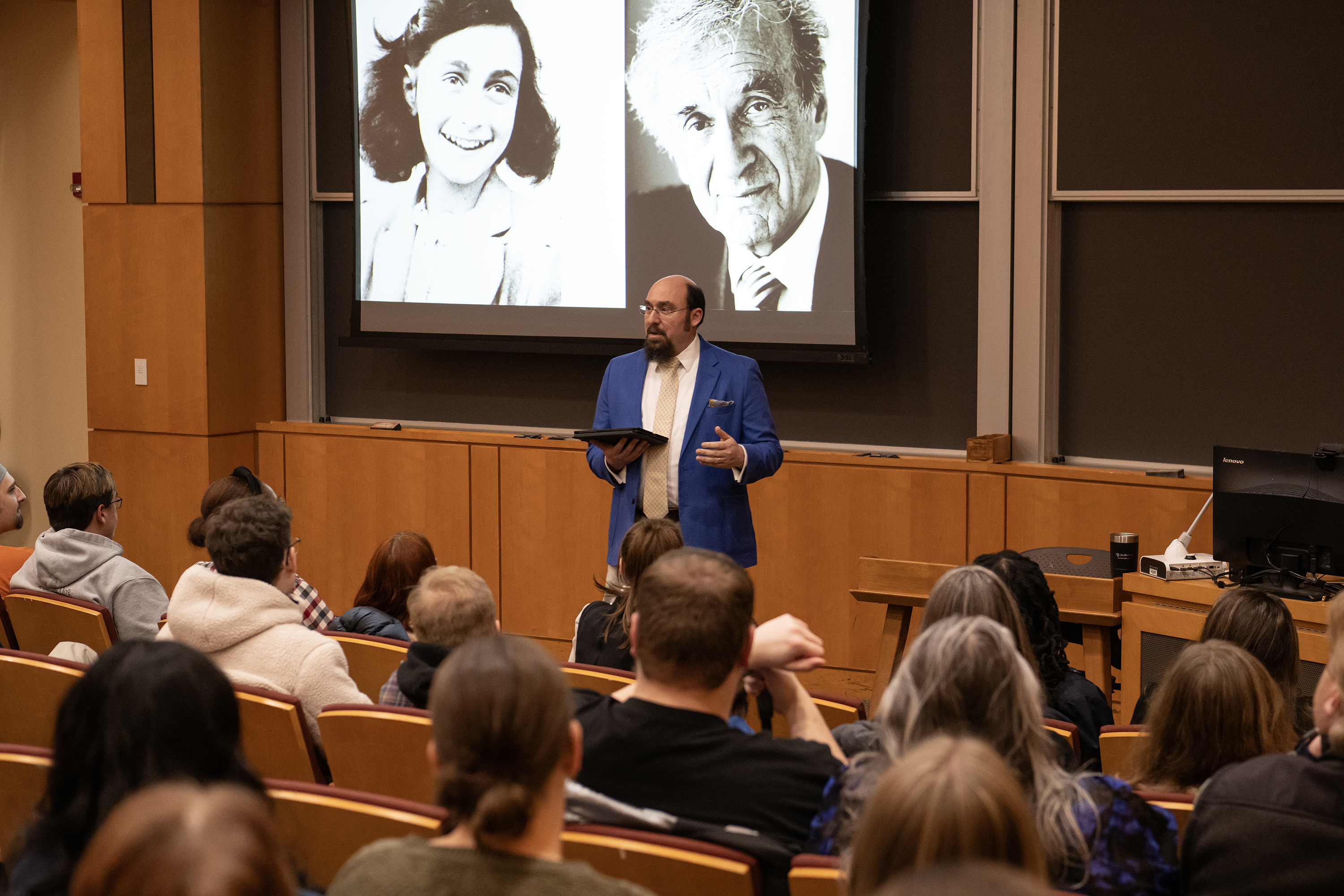 Aaron Krochmal addresses a room of students regarding the Holocaust.