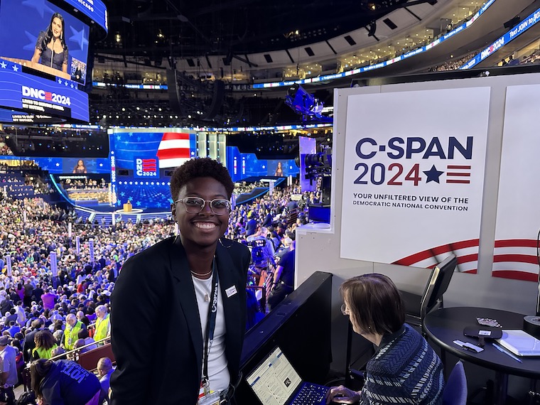 Washington College graduate Leslie Collins reporting live at the DNC