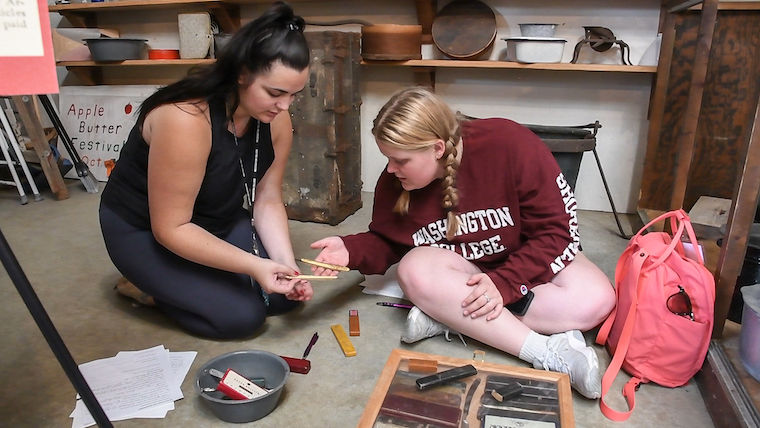 Washington College students examine artifacts in the Kent Museum. 