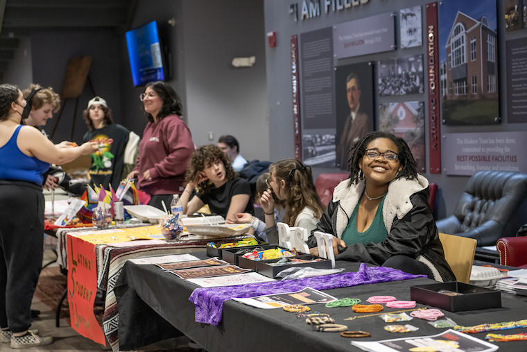 Students at club sign-up tables. 