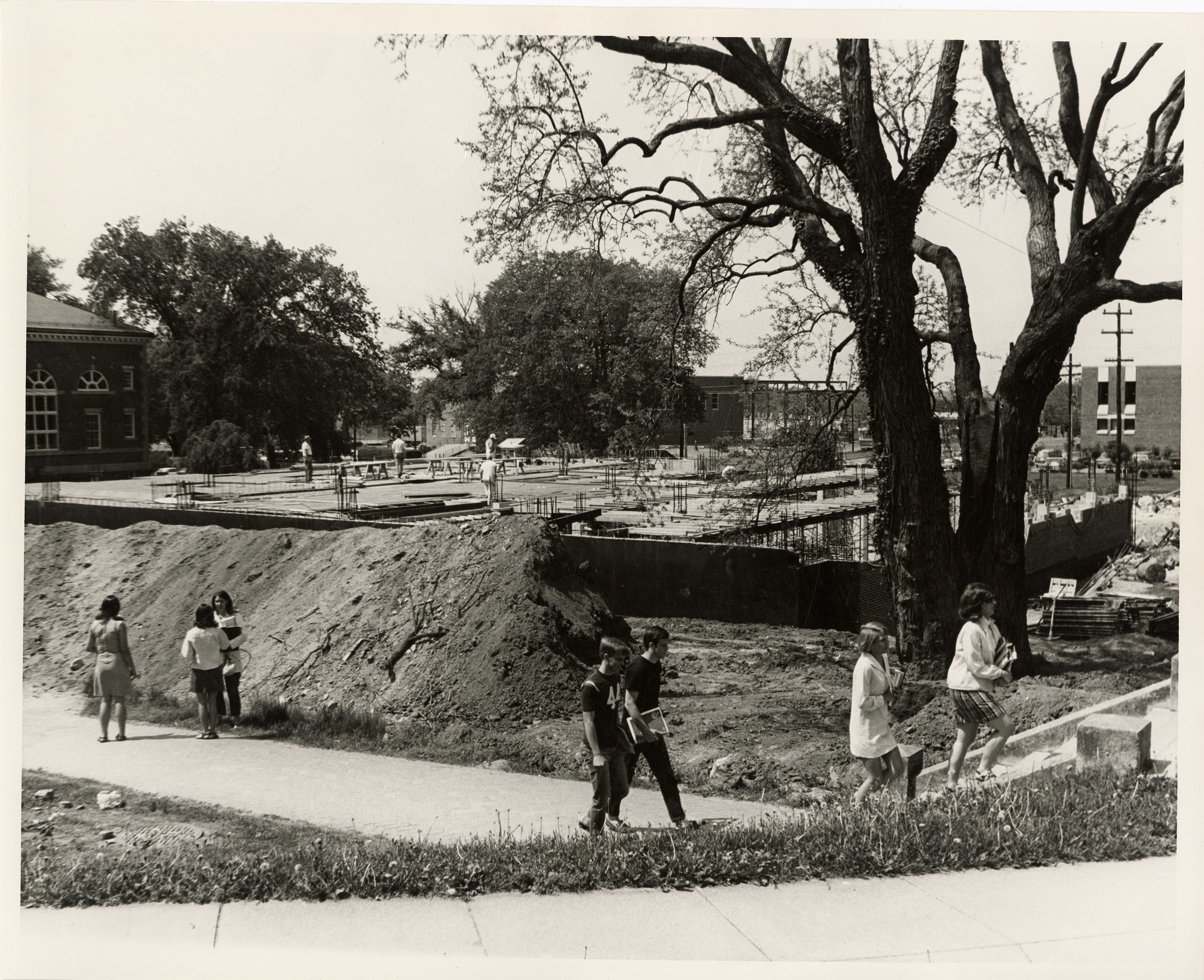 students walking by construction