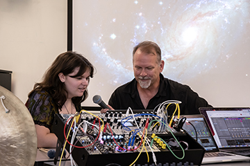 Stevie Lyles '26 and music professor Ken Schweitzer recording